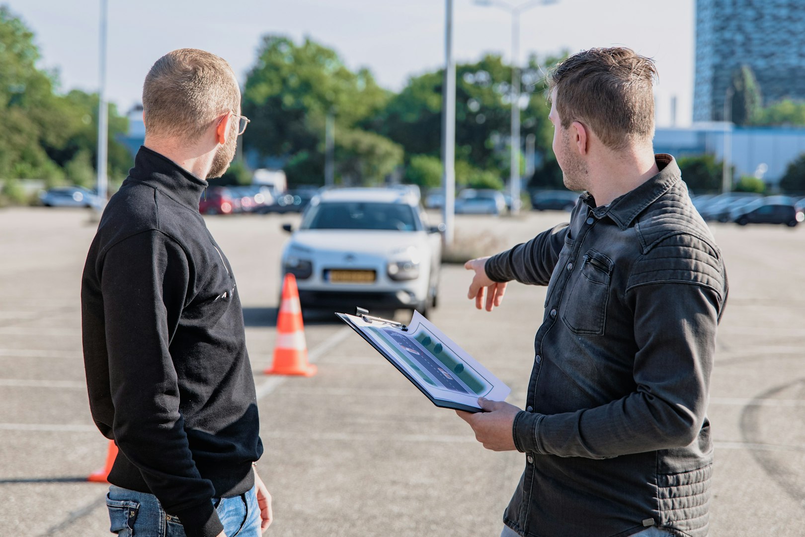 Rembjers Trafikskola Riskettan Learner Driver Engaged in Training as Instructor Guides Maneuver Steps